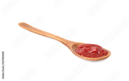 Ketchup in wooden spoon isolated on white