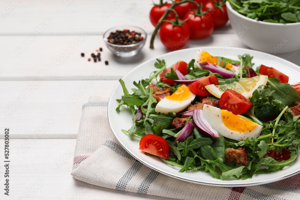 Delicious salad with boiled eggs, vegetables and bacon on white wooden table, closeup. Space for text Delicious salad with boiled eggs, vegetables and bacon on white wooden table, closeup. Space for text