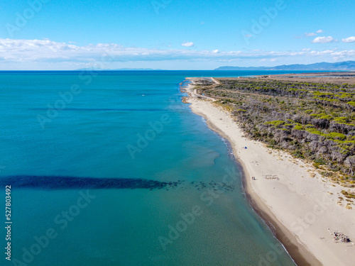 Aerial view of Alberese s beach during a sunny summer day  in a northerly direction . Sea  nature and sandy beach in Alberese  Maremma National Park in the beautiful Tuscany territory.