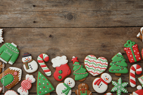 Many different delicious Christmas cookies on wooden table, flat lay. Space for text
