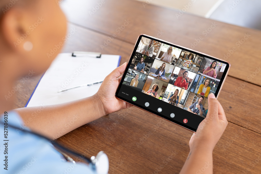 Multiracial business people on video conference with african american female doctor Multiracial business people on video conference with african american female doctor