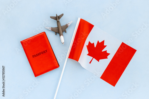 Flag of Canada with passport. Travel visa and citizenship concept