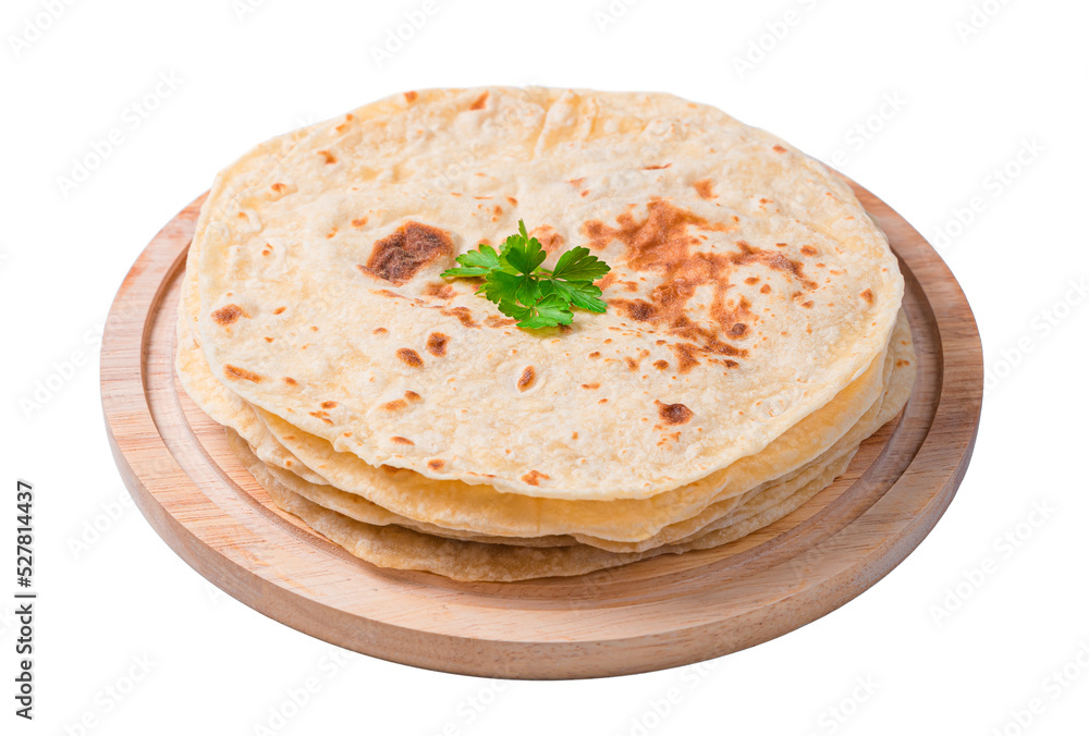 Chapati tortillas with fresh herbs are isolated in close-up on a white background. Traditional Indian flatbreads. Side view, close-up
