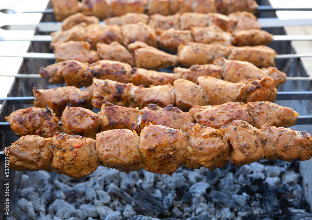 Shish kebab is prepared on a charcoal grill