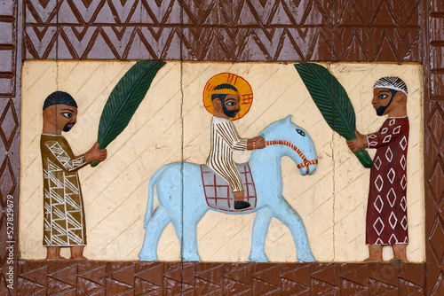 Artwork on the door of the Holy sacrament church, Dasso. Jesus entering Jerusalem on Palm Sunday