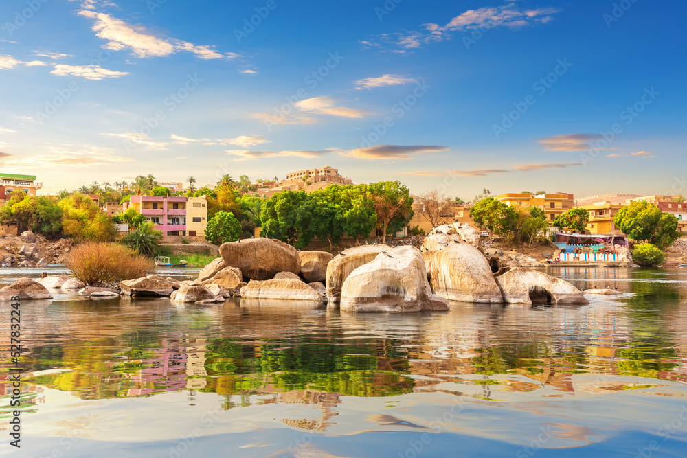 Picturesque banks of the Nile and traditional buildings of Aswan, Egypt