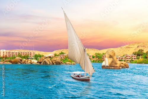 Famous sailboat and the Nile River scenery, sunset view, Aswan, Egypt
