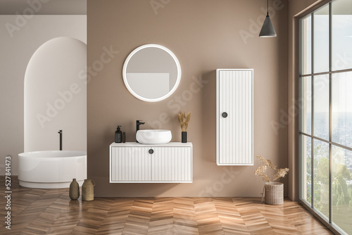 Modern bathroom interior with beige walls  white basin with oval mirror  bathtub and parquet floor. Minimalist beige bathroom with modern furniture. 3D rendering
