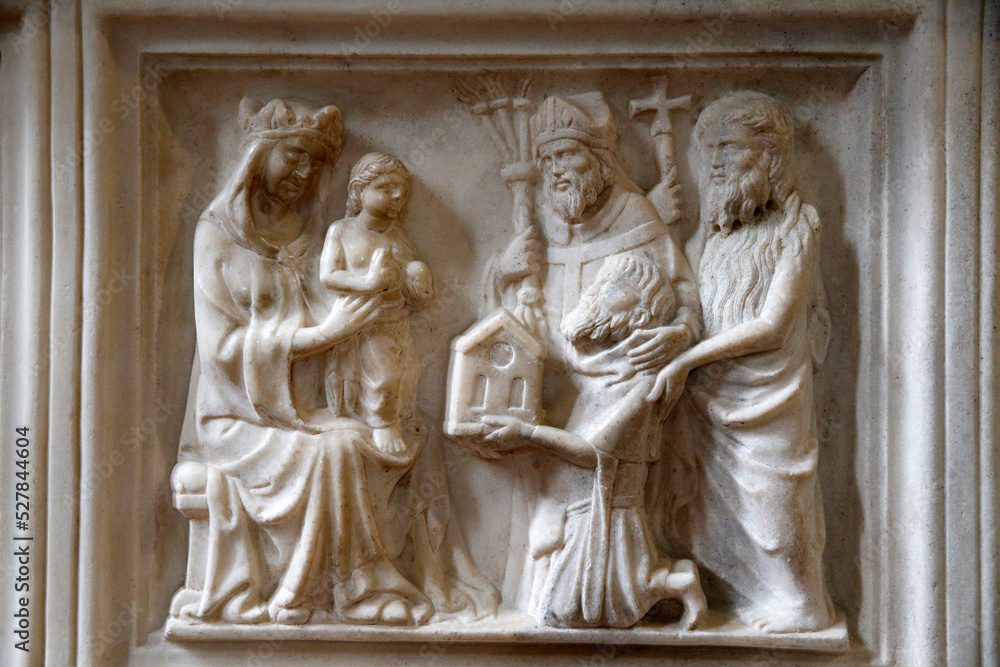 Relief carving in San Marco's church, Milan. Virgin and child with saints.