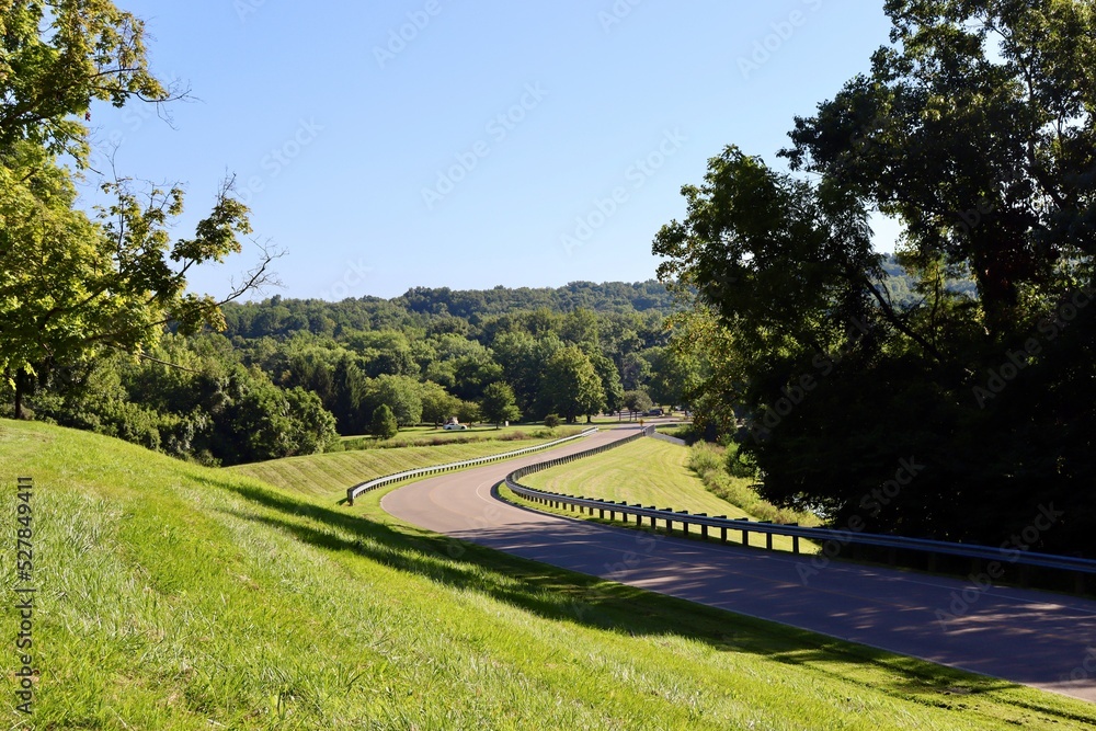 The winding road in the countryside on a sunny day.