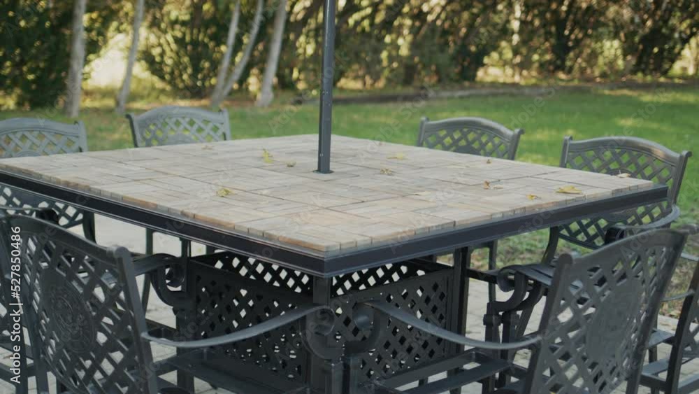 Empty table on the summer playground of the cafe. The end of the season and the arrival of autumn