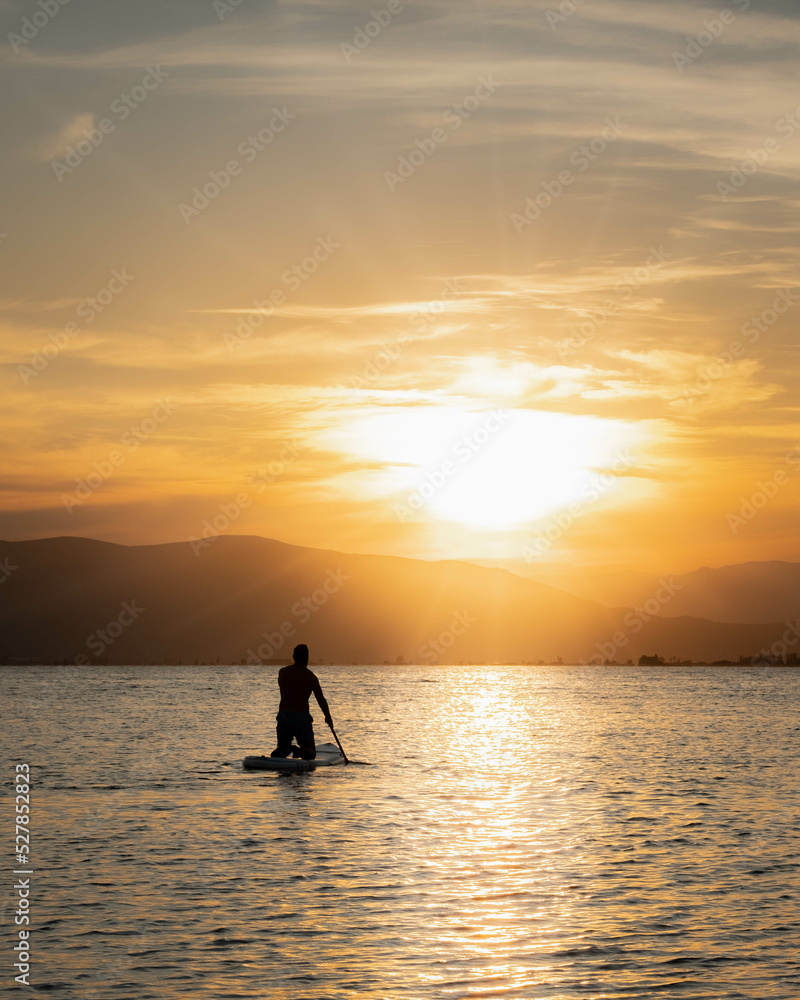 Sunset with paddle surfing