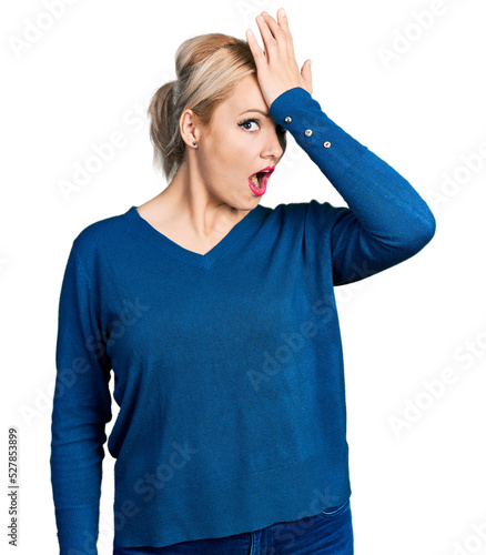 Young blonde woman wearing casual clothes surprised with hand on head for mistake, remember error. forgot, bad memory concept.