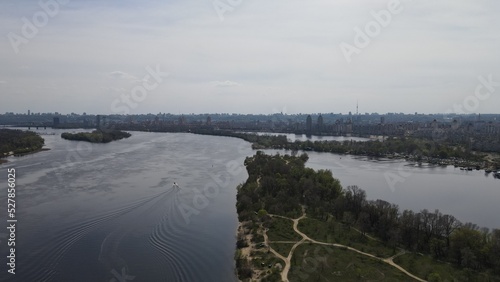 Photo of the Dnieper River from flight altitude  drone shooting. Forest next to the river