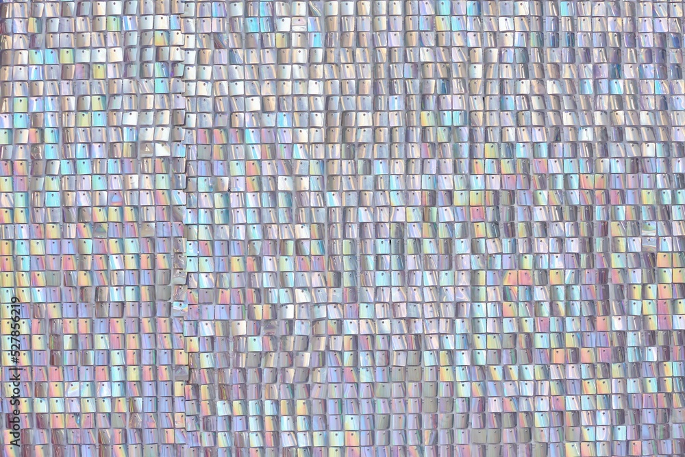 Fototapeta premium Abstract texture of pearl-colored sequins.