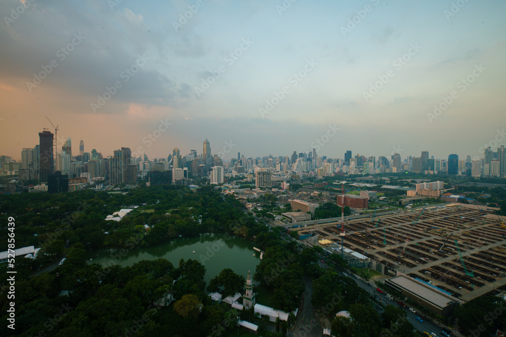 Fototapeta premium AErial view city green tree park around by modern office building