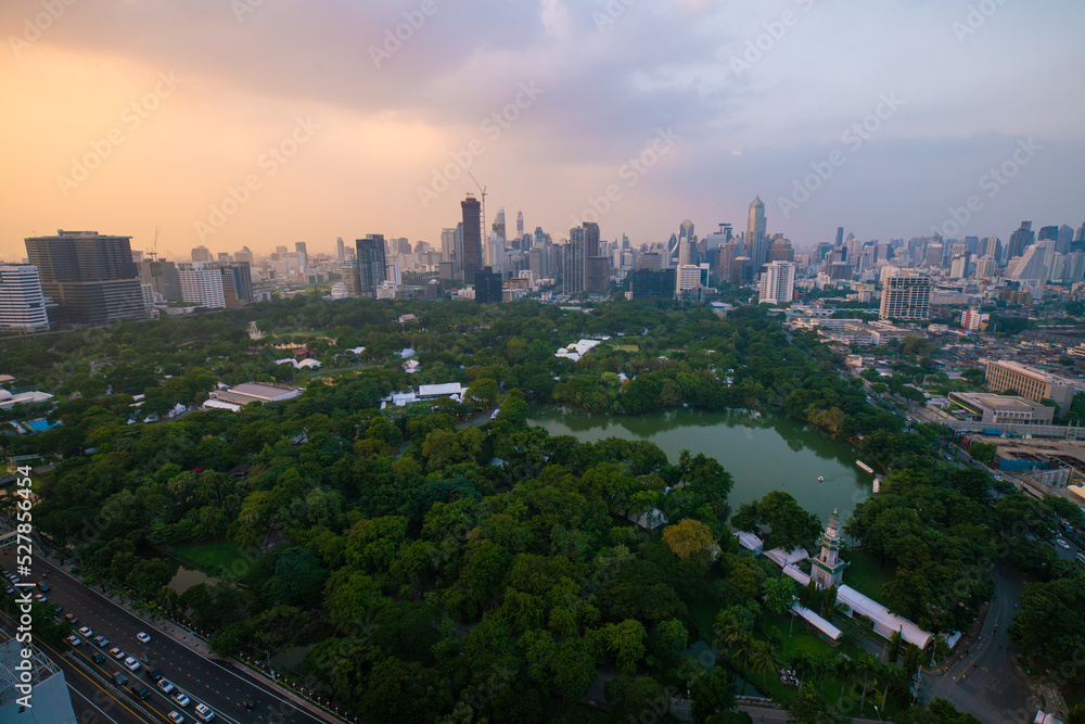 Fototapeta premium AErial view city green tree park around by modern office building