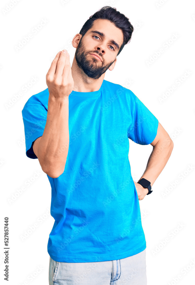 Young handsome man with beard wearing casual t-shirt doing italian gesture with hand and fingers confident expression Young handsome man with beard wearing casual t-shirt doing italian gesture with hand and fingers confident expression
