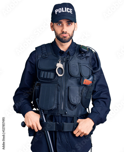 Young handsome man with beard wearing police uniform depressed and worry for distress, crying angry and afraid. sad expression.