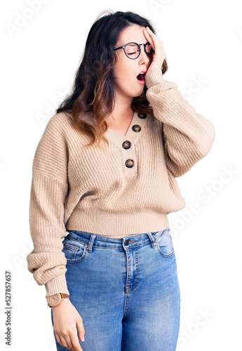Beautiful young brunette woman wearing casual clothes and glasses yawning tired covering half face, eye and mouth with hand. face hurts in pain.