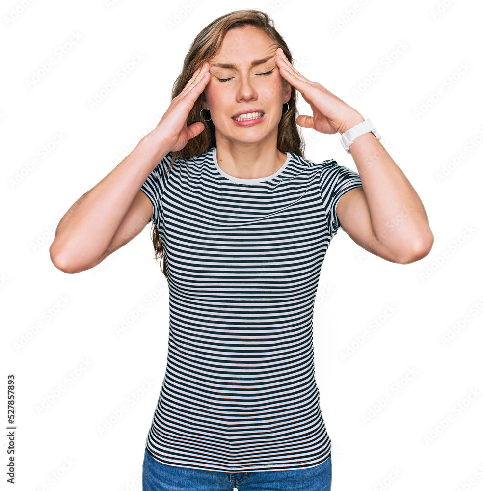 Young blonde woman wearing casual clothes with hand on head for pain in head because stress. suffering migraine. Young blonde woman wearing casual clothes with hand on head for pain in head because stress. suffering migraine.