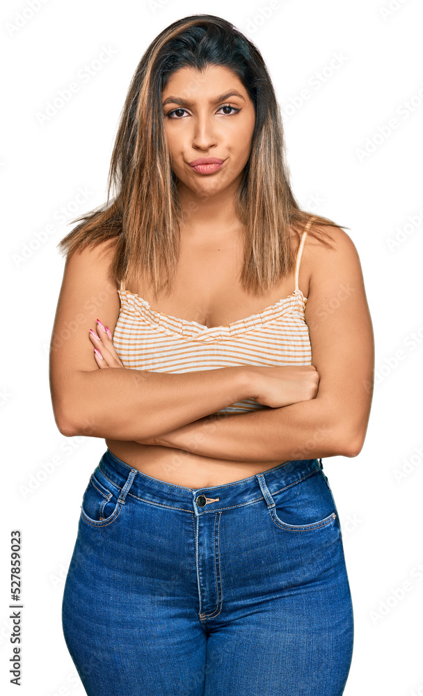 Beautiful brunette woman wearing casual clothes skeptic and nervous, disapproving expression on face with crossed arms. negative person. Beautiful brunette woman wearing casual clothes skeptic and nervous, disapproving expression on face with crossed arms. negative person.