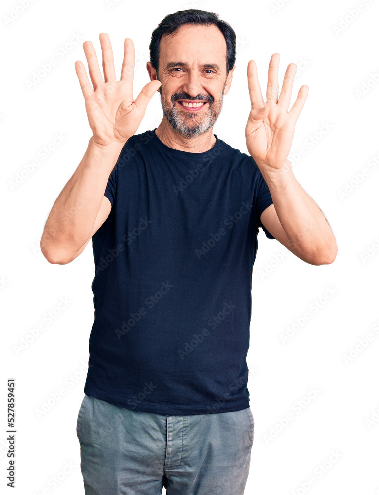Naklejka premium Middle age handsome man wearing casual t-shirt showing and pointing up with fingers number nine while smiling confident and happy.