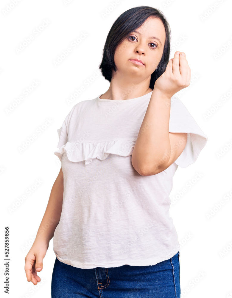 Brunette woman with down syndrome wearing casual white tshirt doing italian gesture with hand and fingers confident expression Brunette woman with down syndrome wearing casual white tshirt doing italian gesture with hand and fingers confident expression