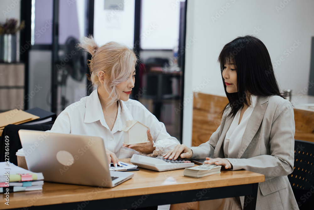 Two businesswoman working on office, business financial planning and meeting concept. Two businesswoman working on office, business financial planning and meeting concept.