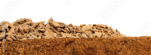 Isolated view of many concrete debris brought from the demolition of roads and piles, leaving on the ground slopes in the Thai countryside.