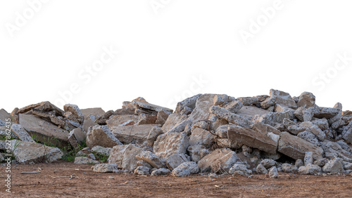 Many of the concrete debris is damaged by the removal of old roads that have been left on the ground and grass growing.