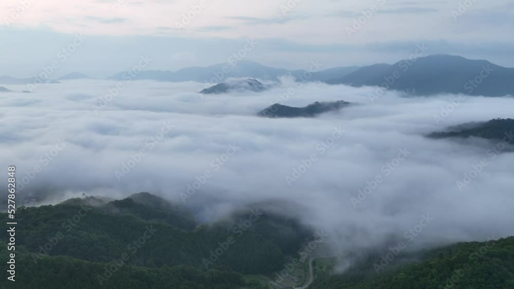 Slow aerial move in towards Takeda Castle in sea of clouds at dawn Slow aerial move in towards Takeda Castle in sea of clouds at dawn