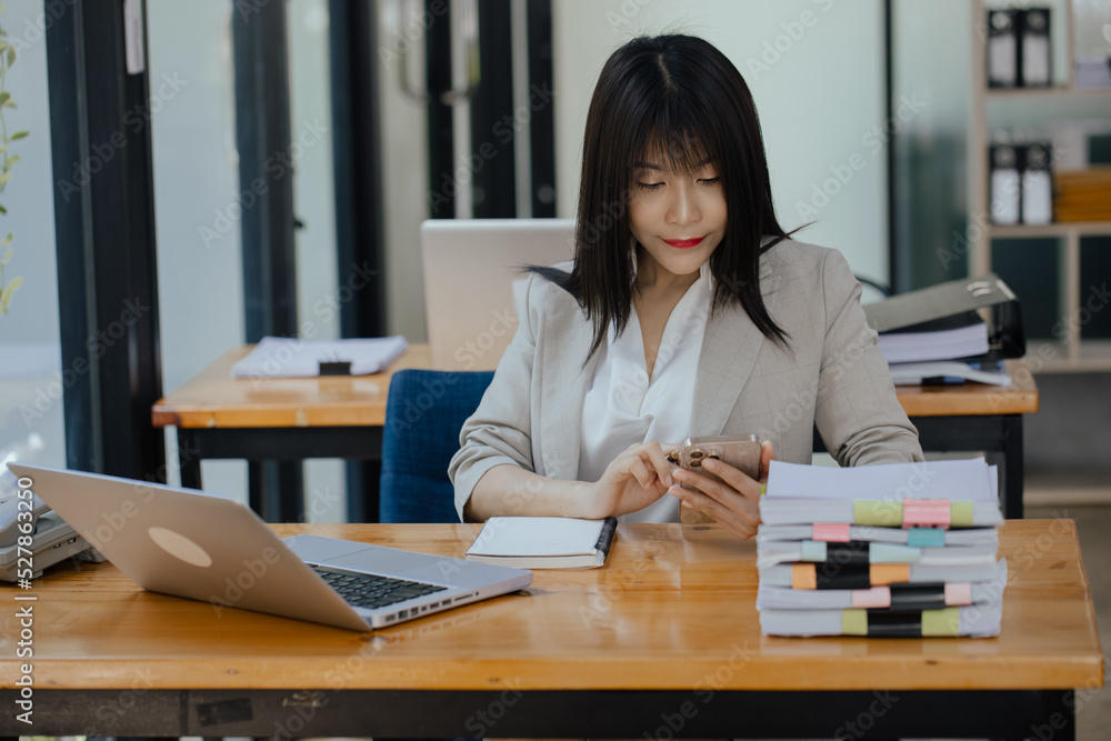Asian businesswoman working with calculator and laptop computer at office workplace. business planning, investment and marketing on table in office.
Asian businesswoman working with calculator and laptop computer at office workplace. business planning, investment and marketing on table in office.