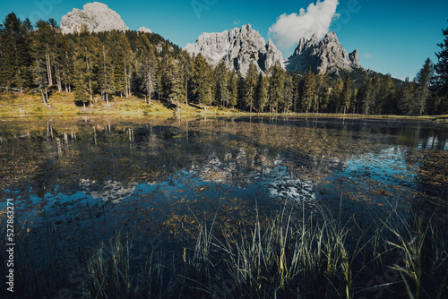 lake reflection in the dolomites at summer time