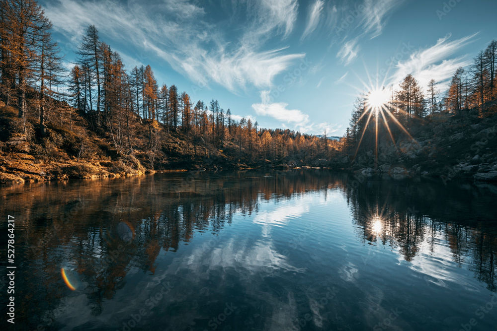 sunset over the alpine lake in autumn