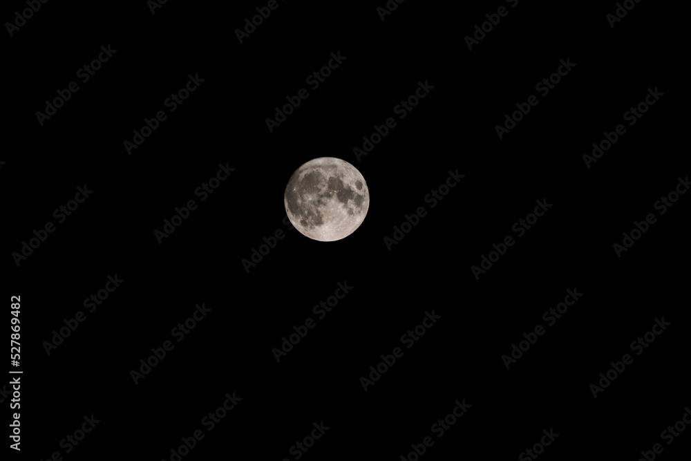 Full moon at largest also called supermoon, on black background Full moon at largest also called supermoon, on black background