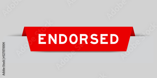 Red color inserted label with word endorsed on gray background