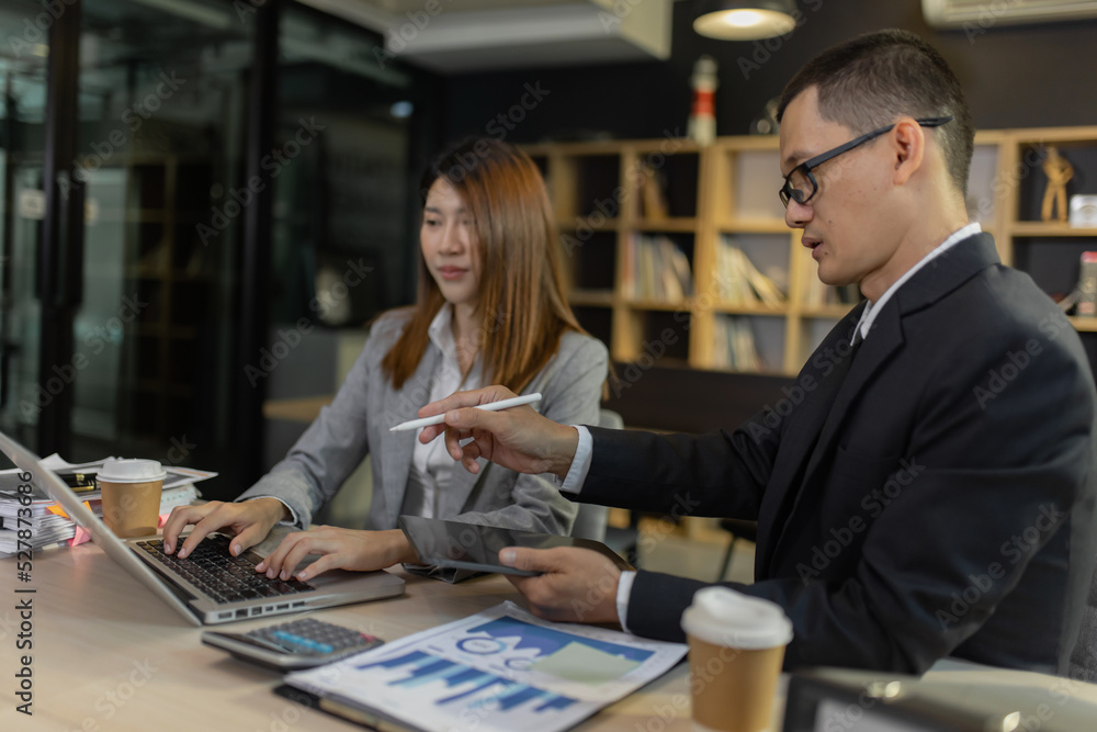 Person analyzing figures, Two businessman working on tablet and new startup marketing idea presentation, Business meeting discussion startup concept.