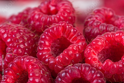 Ripe raspberries fruit, vegetarian healthy food close-up