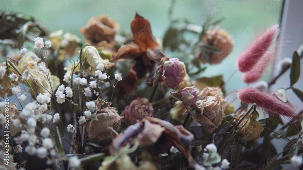 Slow transition from a dried rose to a whole bouquet of a minimalistic floral arrangement. Slow transition from a dried rose to a whole bouquet of a minimalistic floral arrangement.