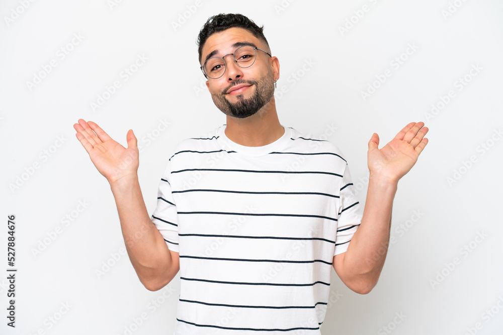 Young Arab handsome man isolated on white background making doubts gesture Young Arab handsome man isolated on white background making doubts gesture