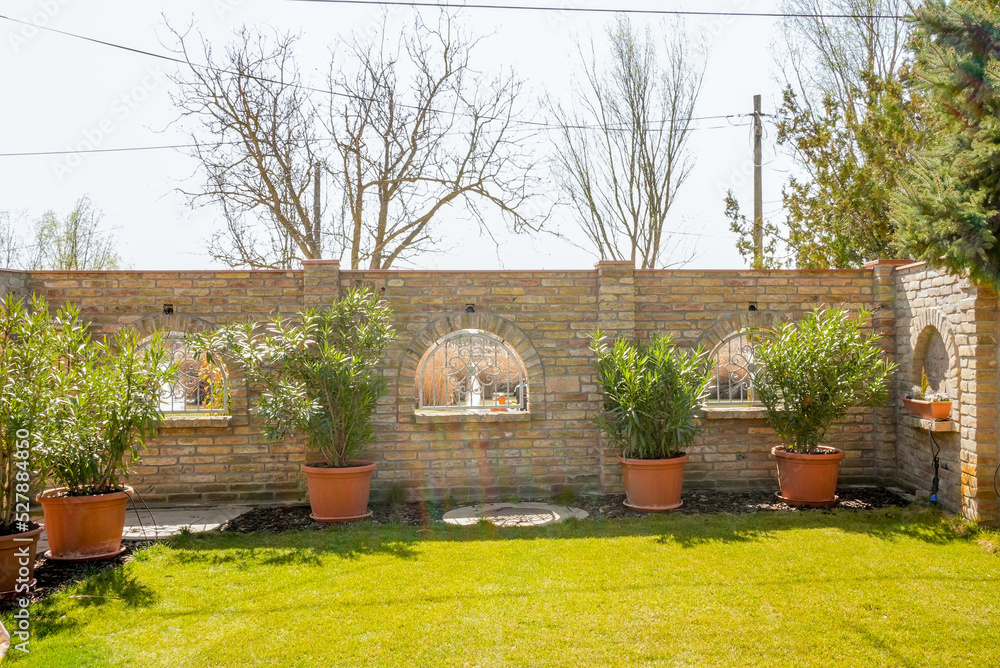 Garden with small trees and green bright grass Garden with small trees and green bright grass