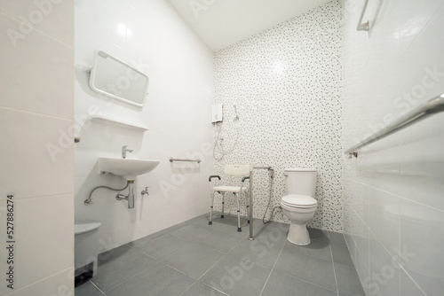 Public handicap toilet for disable people. Men bathroom doors in restroom in restaurant or hotel or shopping mall, empty interior decoration design