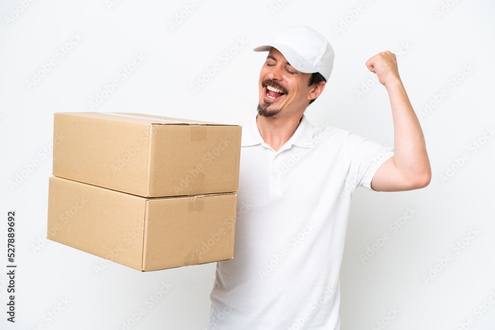 Delivery caucasian man isolated on white background celebrating a victory Delivery caucasian man isolated on white background celebrating a victory