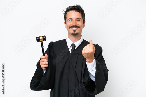Young judge caucasian man isolated on white background doing coming gesture