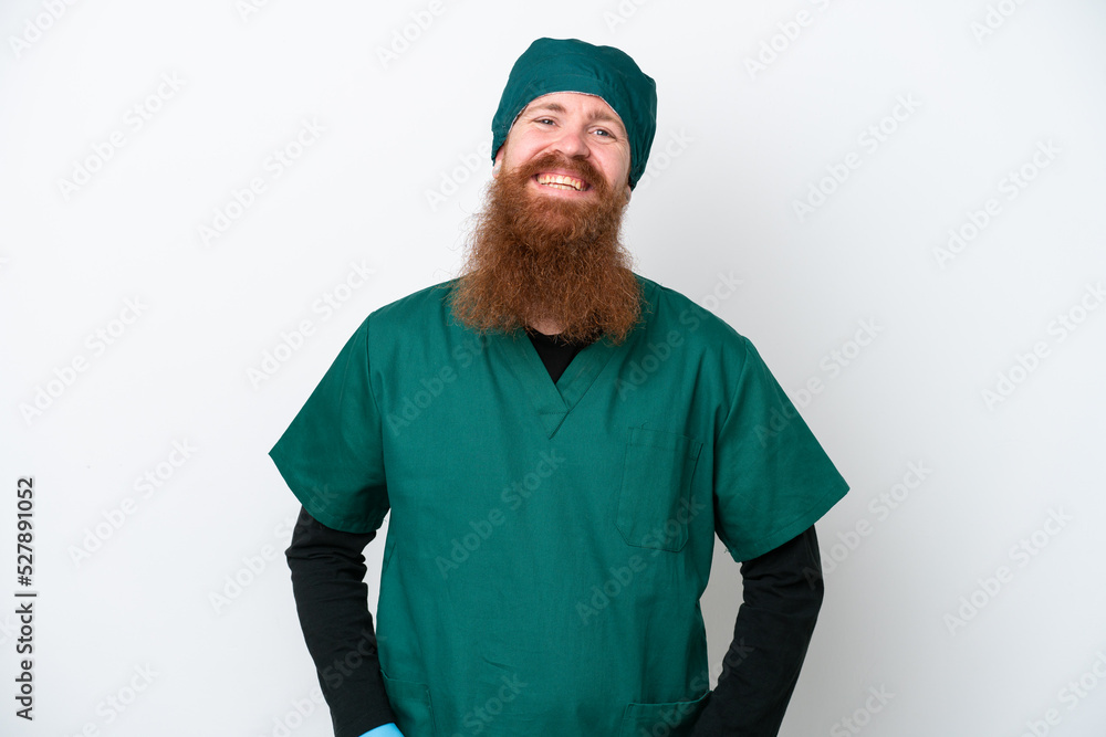 Surgeon redhead man in green uniform isolated on white background laughing Surgeon redhead man in green uniform isolated on white background laughing
