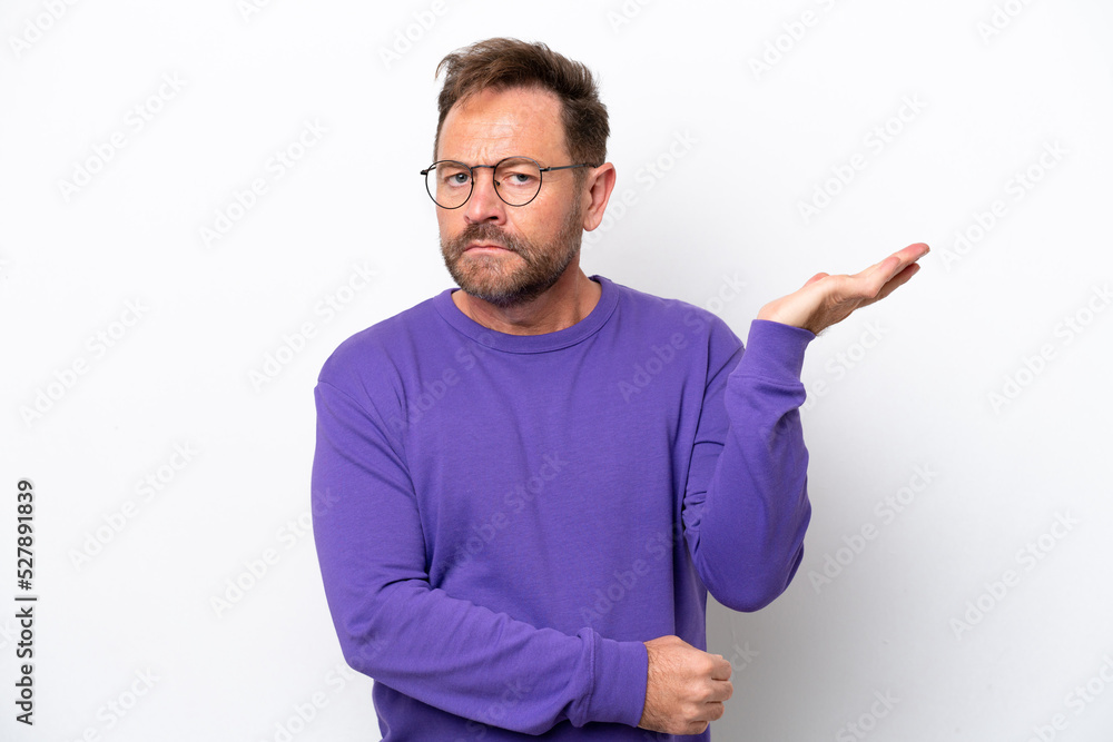 © luismolinero - Middle age caucasian man isolated on white background having doubts