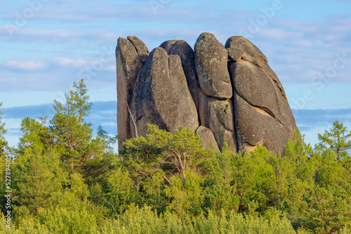 View on top of Feathers Pillar rock or Perja above green taiga against blue sky in the Stolby Nature Reserve in Krasnoyarsk, Russia. Reserve Krasnoyarsk Pillars photo