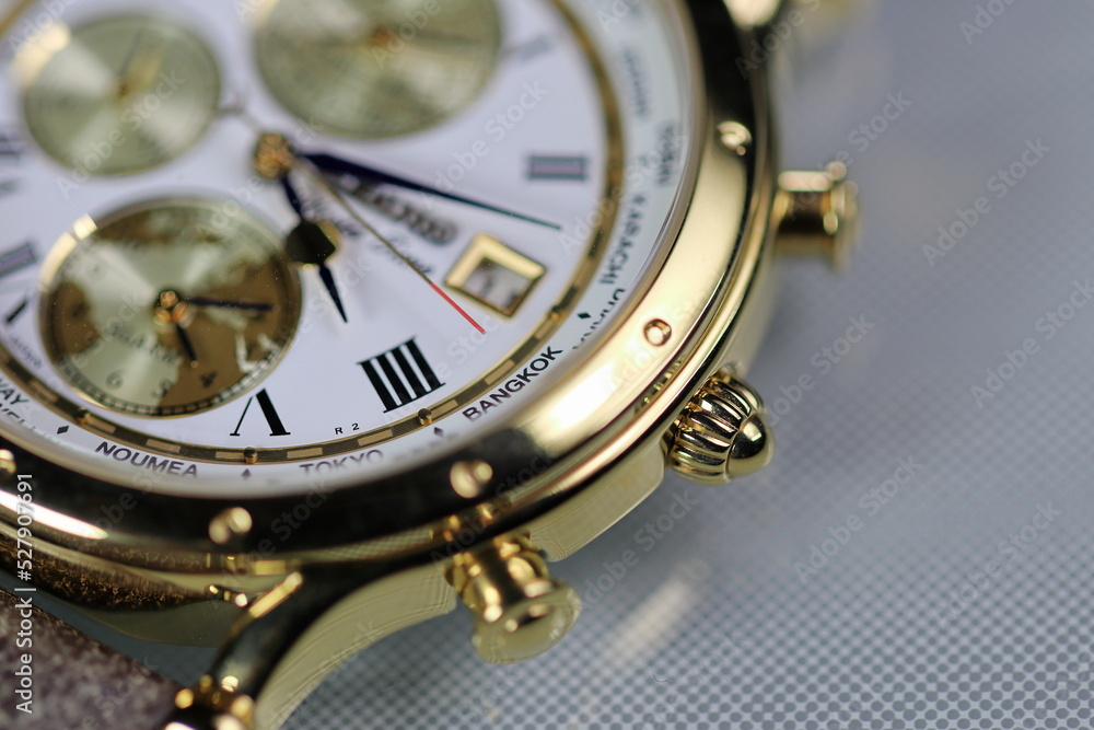 closeup crown of luxury world time men watch.