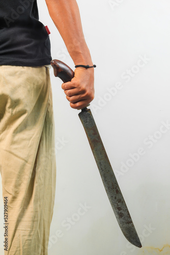 Man holding machete isolated white background.
